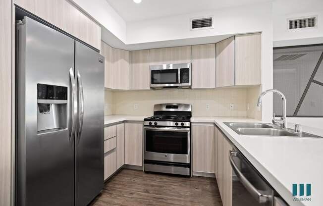 Kitchen with Stainless Refrigerator, Stove, Microwave Oven, and Dishwasher