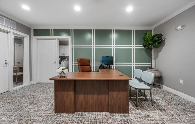 Dedicated office suite, guest seating, and a professional setting designed for focused work, planning, and resident convenience.