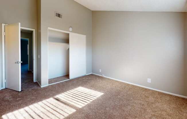 Apartments for Rent Ontario - Rancho Vista - Unfurnished Bedroom With a Spacious Closet, Carpet Flooring, and a Window With Shutters
