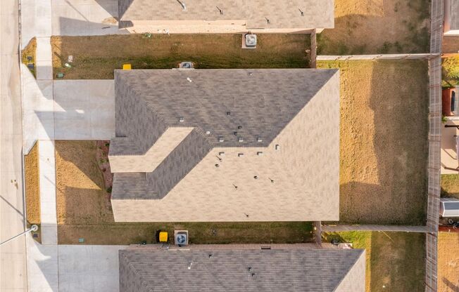 Enjoy open living with a kitchen featuring a breakfast bar sink island, gas range, and walk-in pantry. Relax in a master suite with a 5-foot shower and walk-in closet, plus a private backyard with covered patio and 6-foot fence.