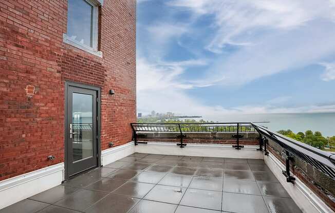 the private balcony has a view of the lake and the city