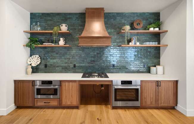 A kitchen with wooden cabinets and a copper hood at The Villas at Anacapa Canyon, Camarillo, 93012