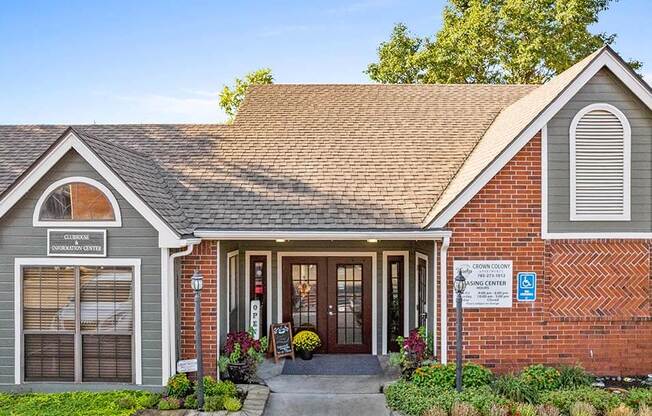 the front of a brick and with a porch