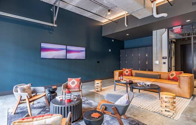 a living room with couches and chairs and a tv