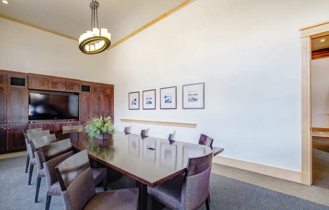a conference room with a long table and chairs