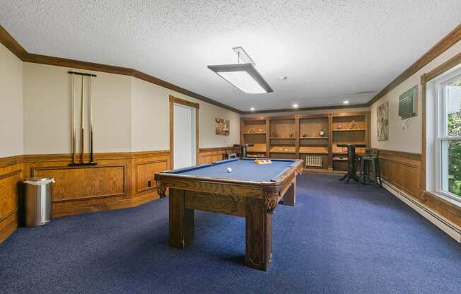 a game room with a pool table