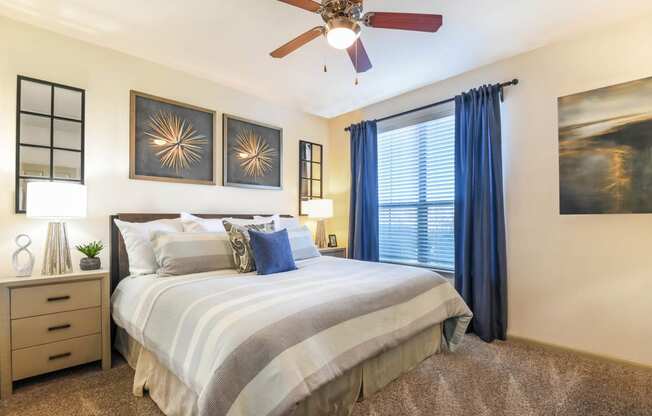 Falls at Copper Lake apartments bedroom with ceiling fan in Houston