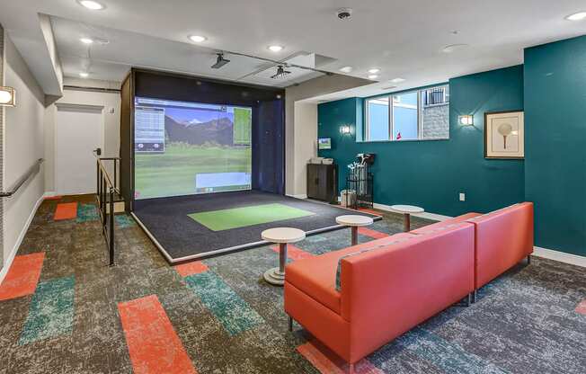 a workout room with a ping pong table and a window overlooking a golf course