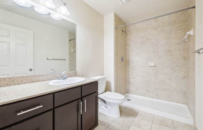 A bathroom with a sink, toilet, and bathtub.
