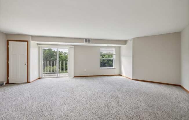 an empty room with three boxes on the floor