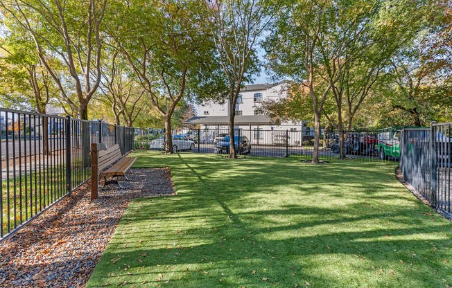 Our newly renovated dog park is now open, featuring fresh turf and plenty of space for your furry friends to play and socialize.
