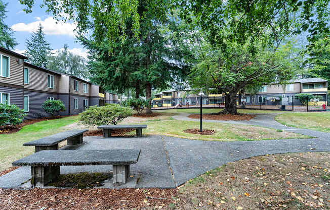 Courtyard with tables and apartment buildings in the background