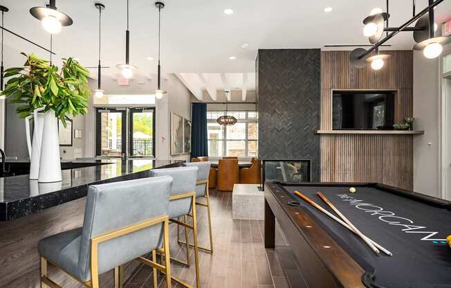 A pool table with the word "CROCKER" written on it in white chalk.