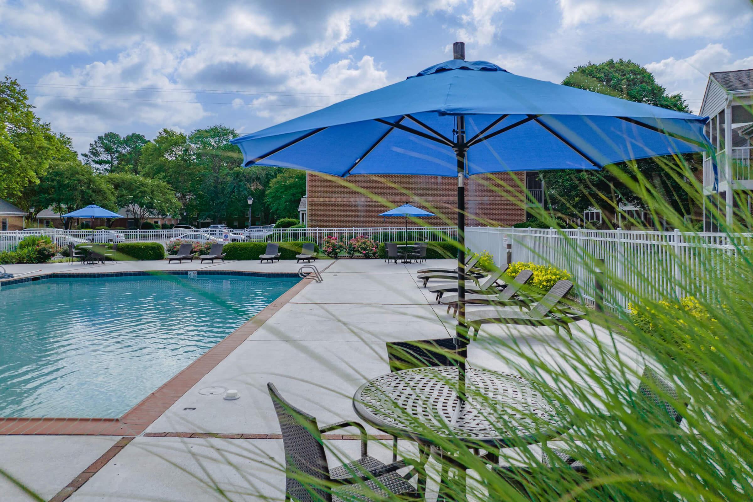 a body of water with a colorful umbrella