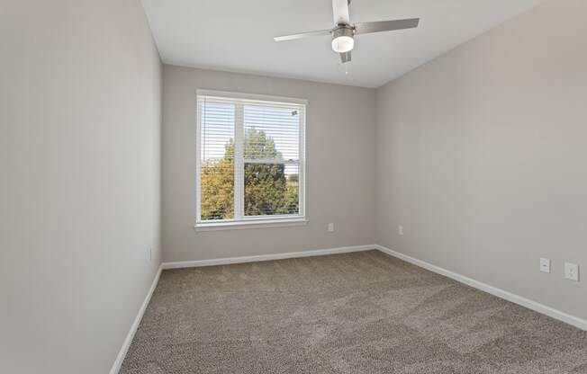 Flatiron West Trade Apartments gray carpeted bedroom