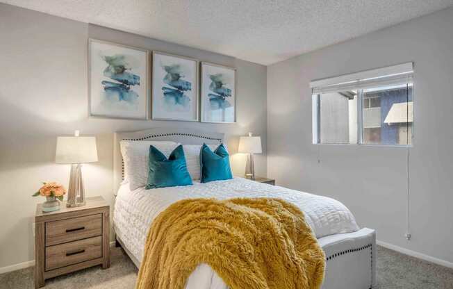 a bedroom with a bed and a window