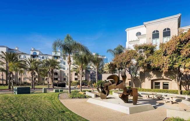 A sculpture in a park with a building in the background. at La Jolla Crossroads Apartments, San Diego, California