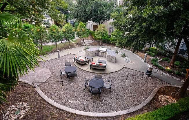 a backyard with a fire pit and patio