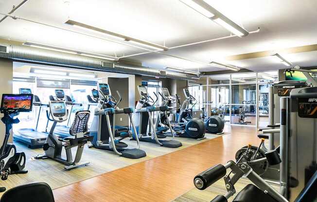 Professional fitness studio with Pilates/yoga zone, virtual training & Precor equipment