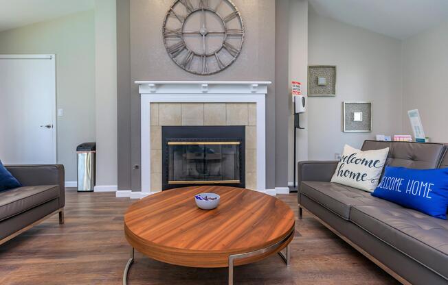 a living room filled with furniture and a clock