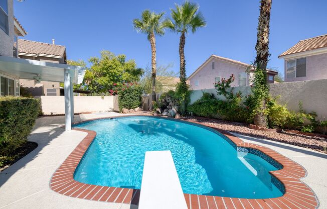 2 Story Summerlin Home with Refreshing Pool & Lush Landscaping