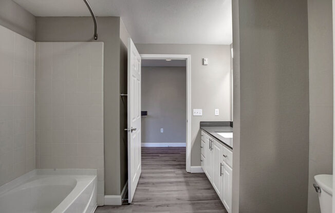 a bathroom with a bathtub and a sink