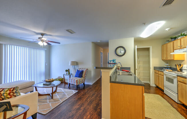 A kitchen with a dining table and chairs in the middle of the room.