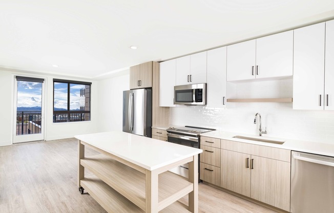 Creating culinary magic with a chef's dream island complete with ample storage, found in the heart of Modera Golden Triangle, Denver, Colorado.