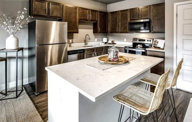 kitchen with stainless steel appliances at Sterling at Prairie Trail in Ankeny, IA