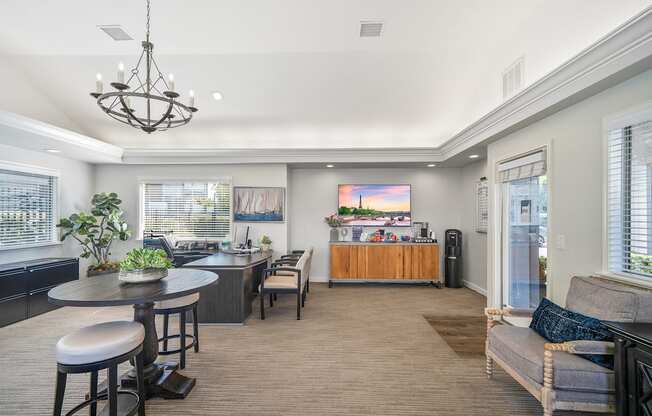 a living room with a kitchen and a dining room