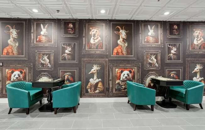 A room with a table surrounded by chairs and pictures of animals on the wall.