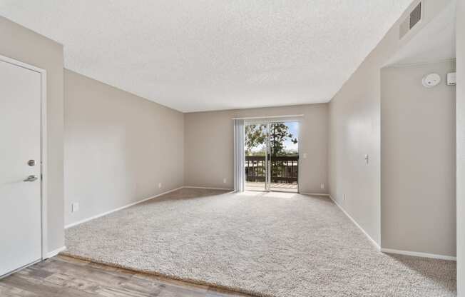 carpeted spacious living room at Terrace Gardens Apartment Homes, Escondido