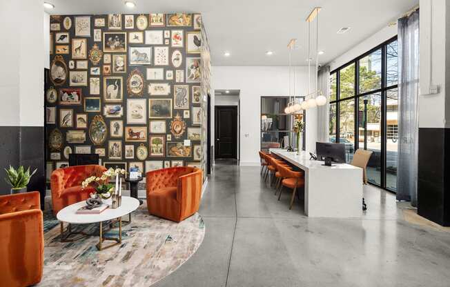 a living room with a wall covered in diplomas