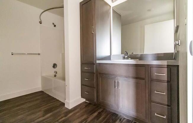 bathroom with a sink and a shower at Loma Villas Apartments in San Bernardino, CA