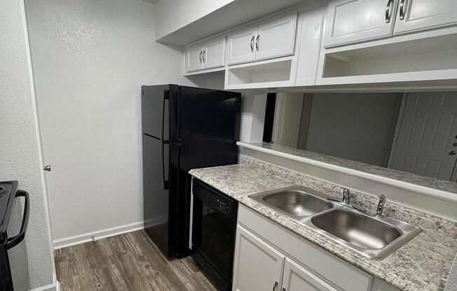 a kitchen with a sink and a microwave