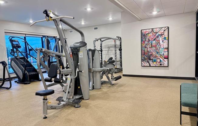 a gym with weights and other exercise equipment in a room