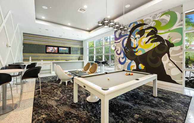 a billiards room with a white pool table