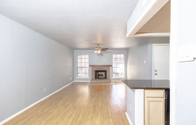 Well maintained 2nd floor condo! All WOOD floors, set back from street. Black granite in Kitchen, Black electric range, matching black microwave.