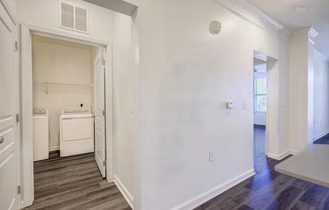 A laundry room with a washer and dryer in it.