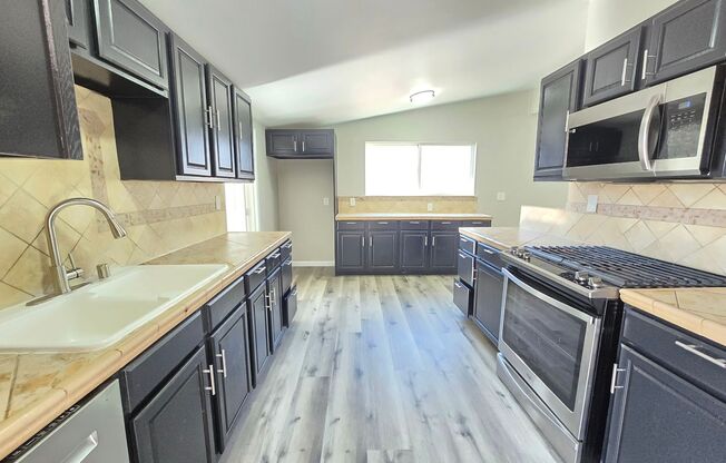Spacious 4- Bedroom Remodeled Home in Palmdale - Gated yard & Utility Credit