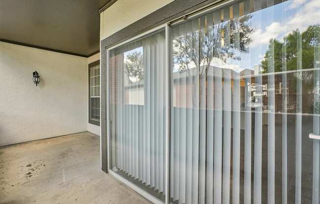 A glass door with a handle is open.
