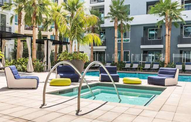 A pool area with a blue and yellow pool chair.