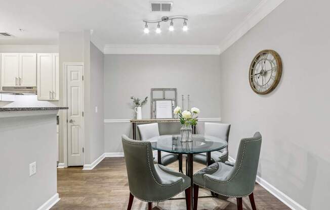 A dining room with a table set for two.