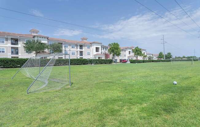 a soccer field at the whispering winds apartments in pearland, tx