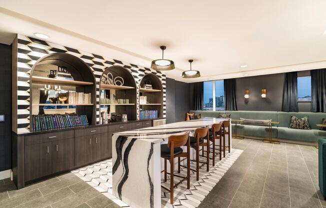8th-floor sky lounge with gathering space, bar area, and sweeping views at Modera Encore apartments in Tampa.