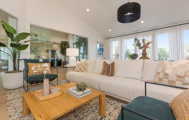 a living room with a white couch and a coffee table