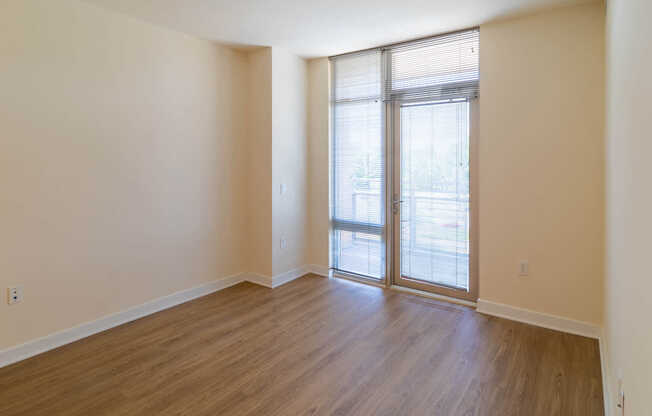 Bedroom with Balcony and Hard Surface Flooring