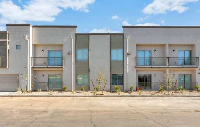 a building with a parking lot in front of it at Allora Phoenix Apartments, Phoenix, Arizona