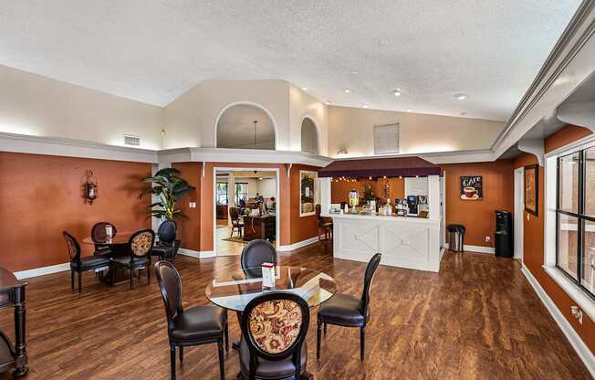 A dining room with a table set for six.