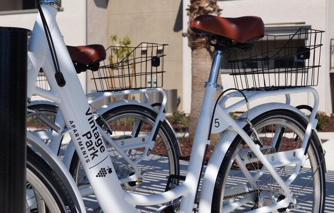 a bicycle is parked next to a chair